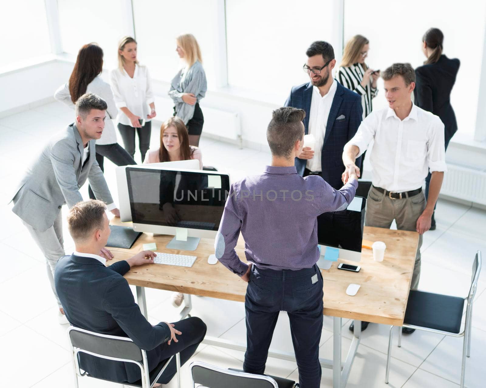 business colleagues greeting each other near the office Desk. business concept