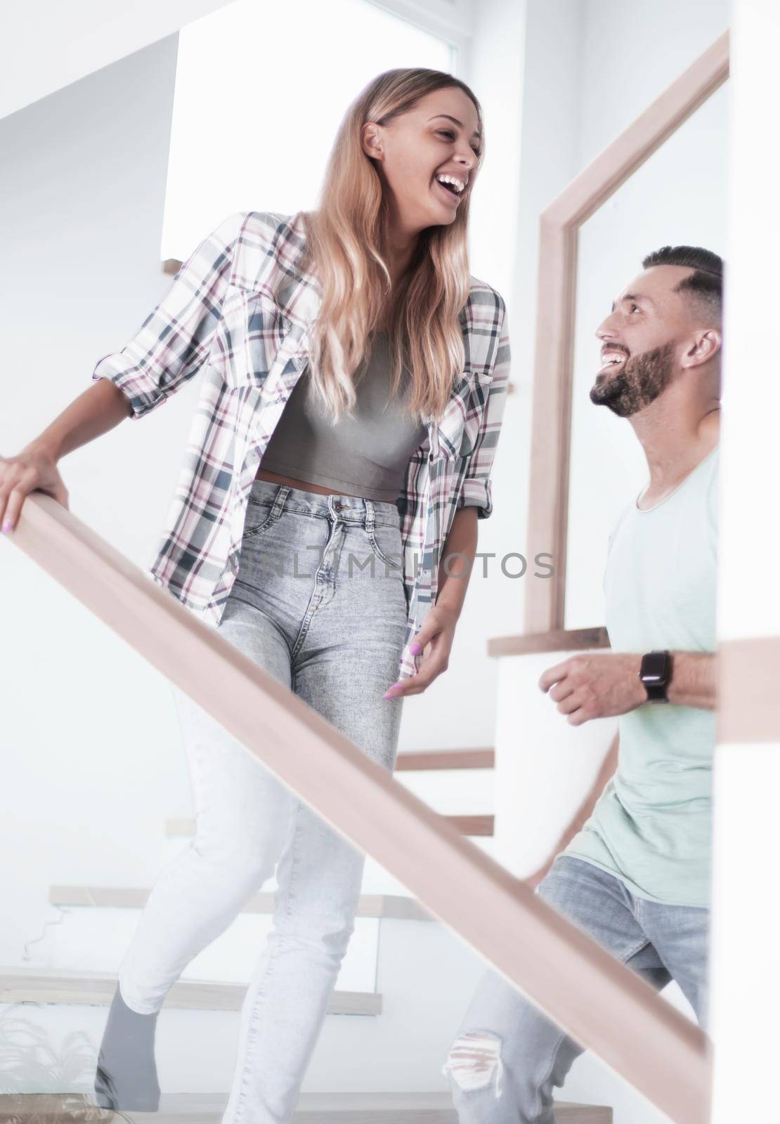 close up. happy couple on the stairs in their new apartment.