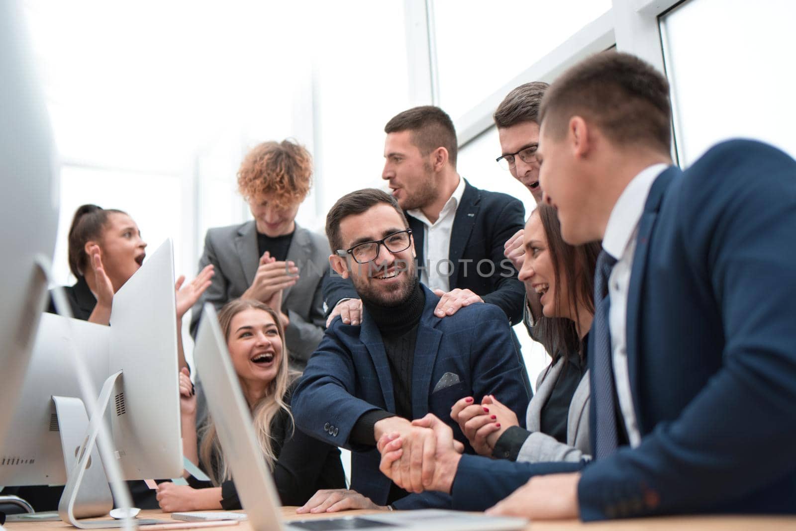 close up. happy business partners shaking hands. concept of cooperation