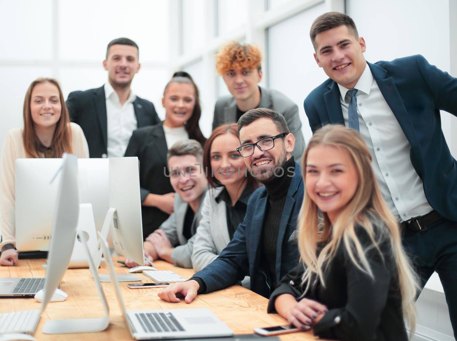 large group of employees in the workplace in the office. photo with copy space