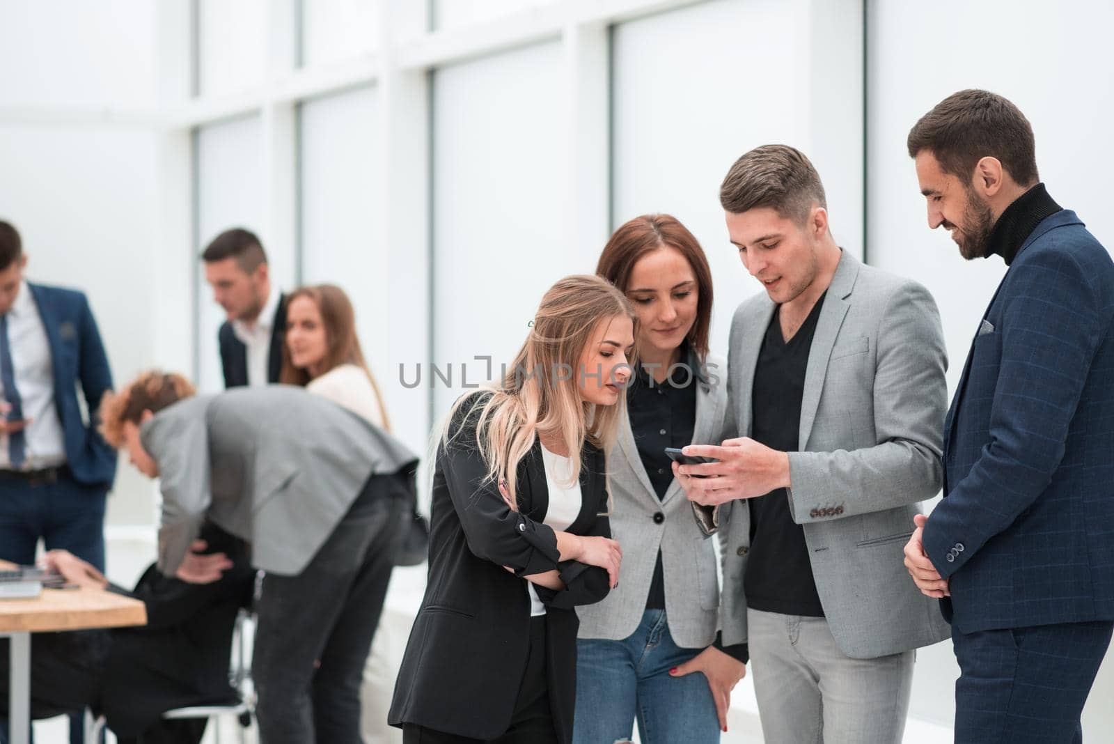 close up. employees reading SMS messages on the smartphone screen