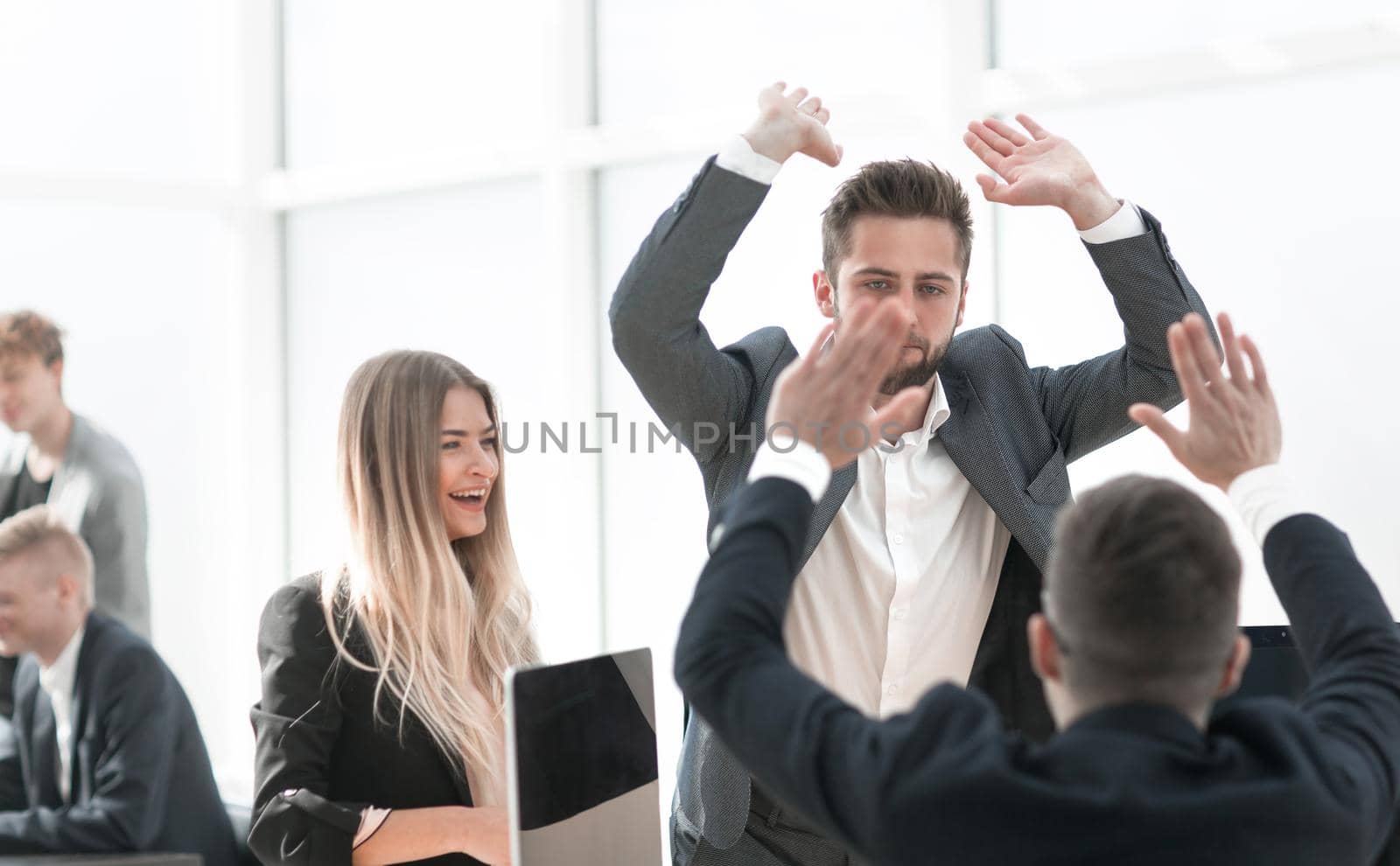 happy employees giving each other a high five. the concept of success.