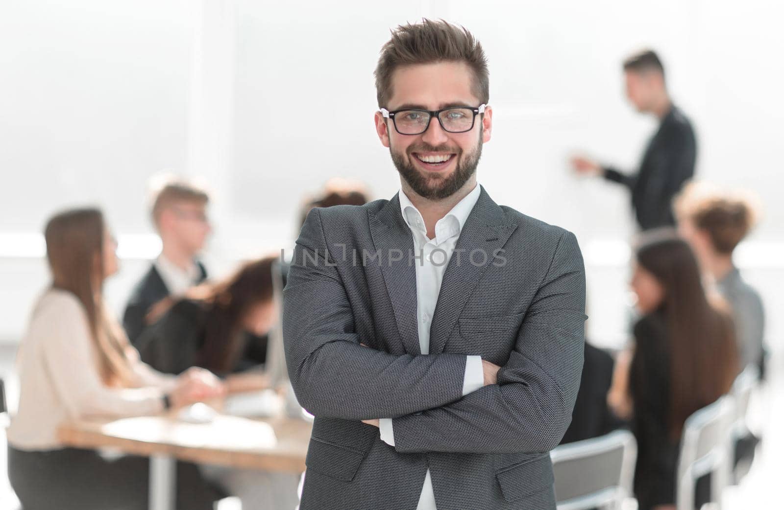 close up. confident businessman standing in his office. business concept