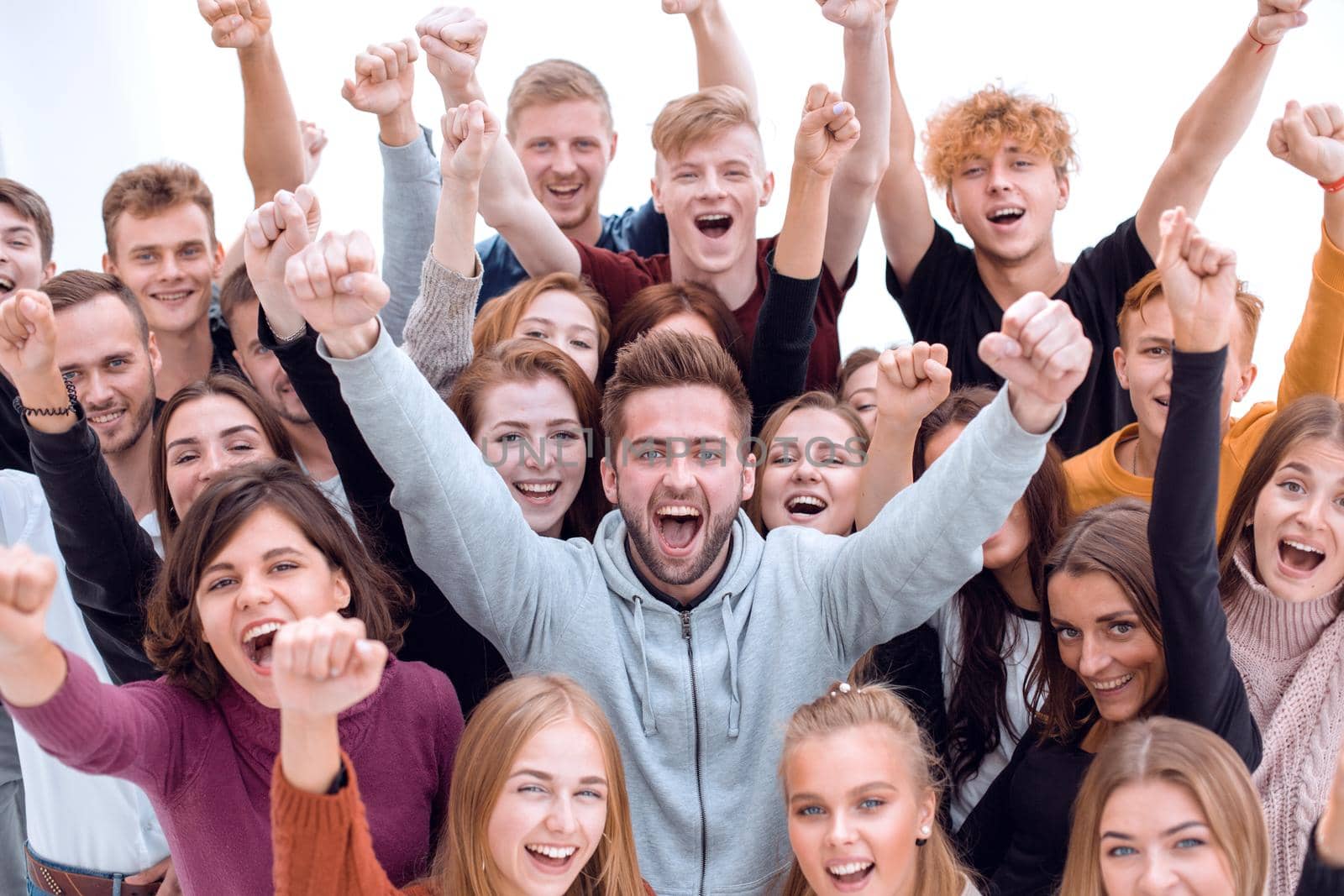 close up. group of happy young people showing their success