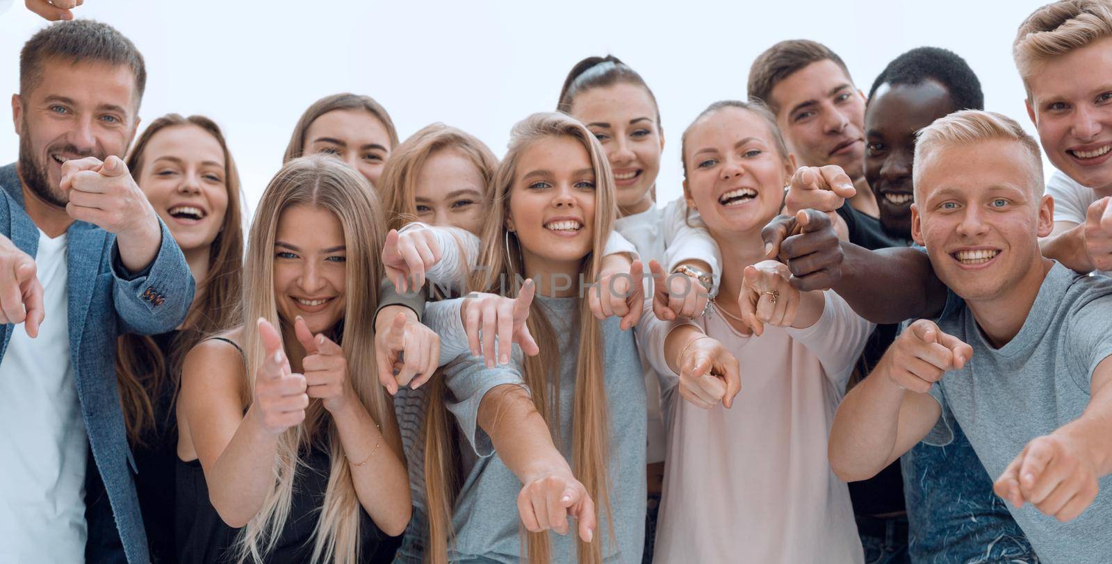 close up. a group of young like-minded people pointing at you