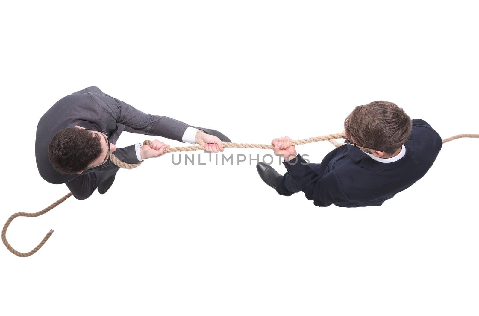 top view. two young businessmen pulling the rope. isolated on white background.