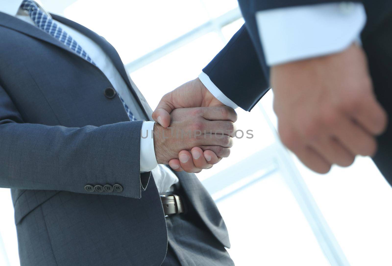 Business men shaking hands making an agreement by asdf
