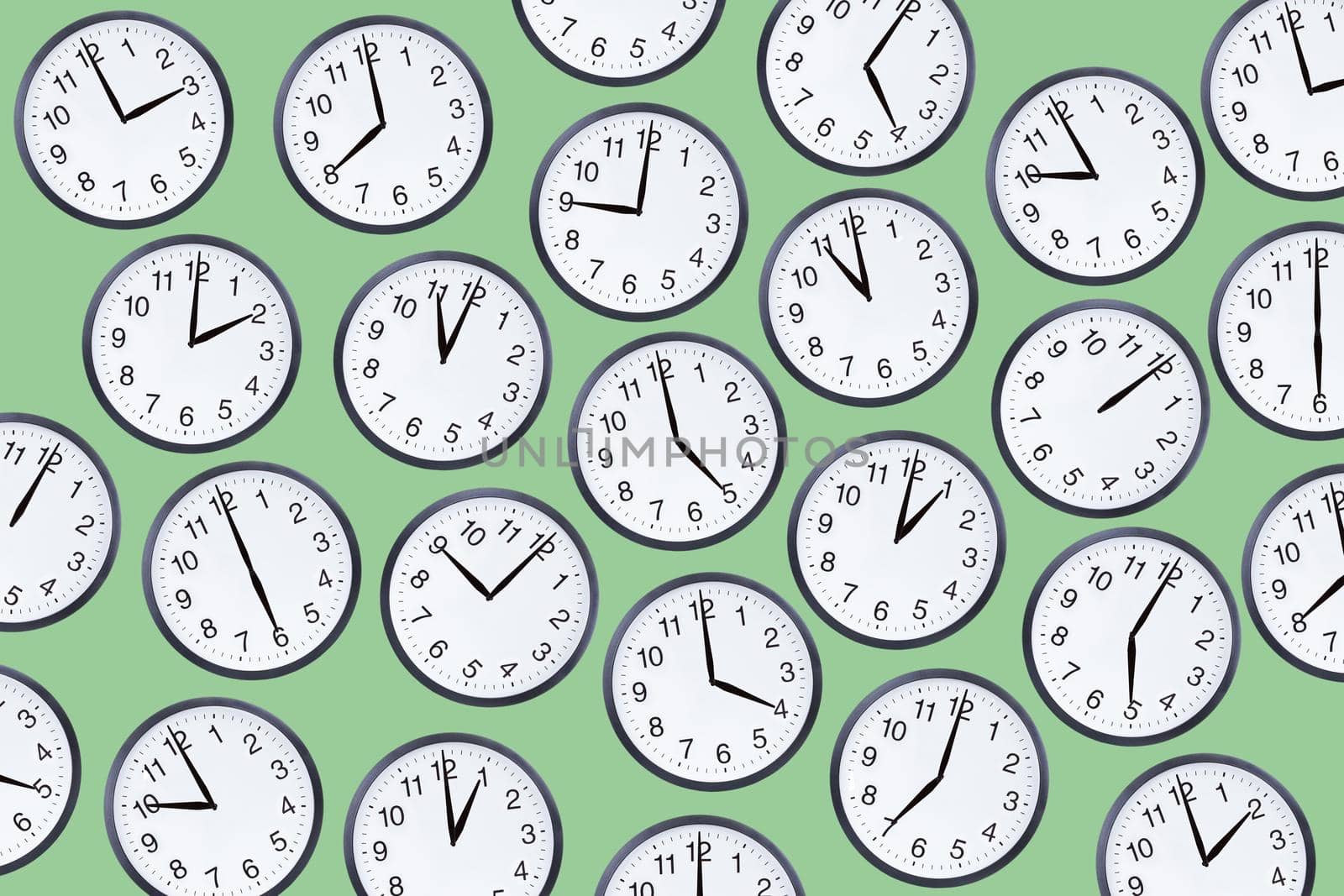 Set of office clocks on green background