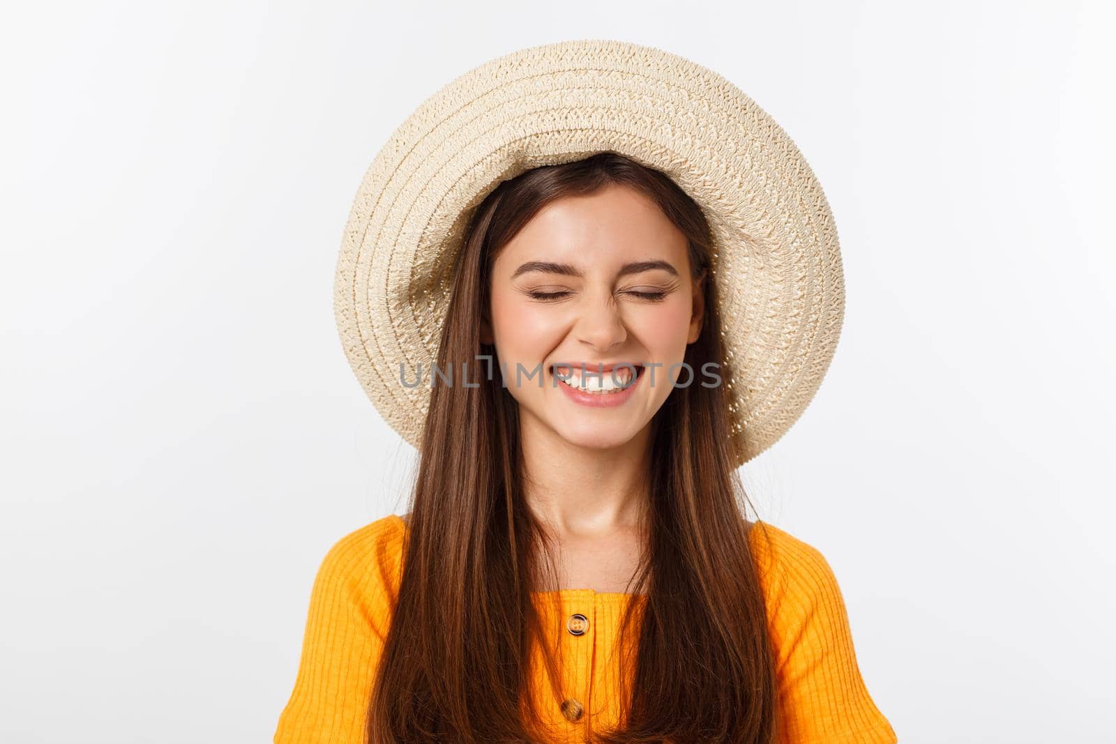 Attractive happy woman preparing for summer vacation on white