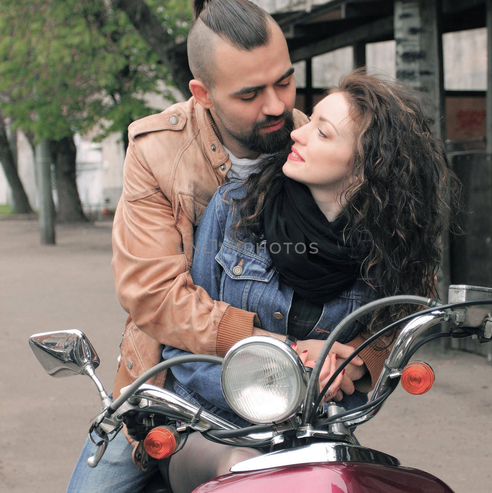 happy loving couple riding a motorcycle . love story