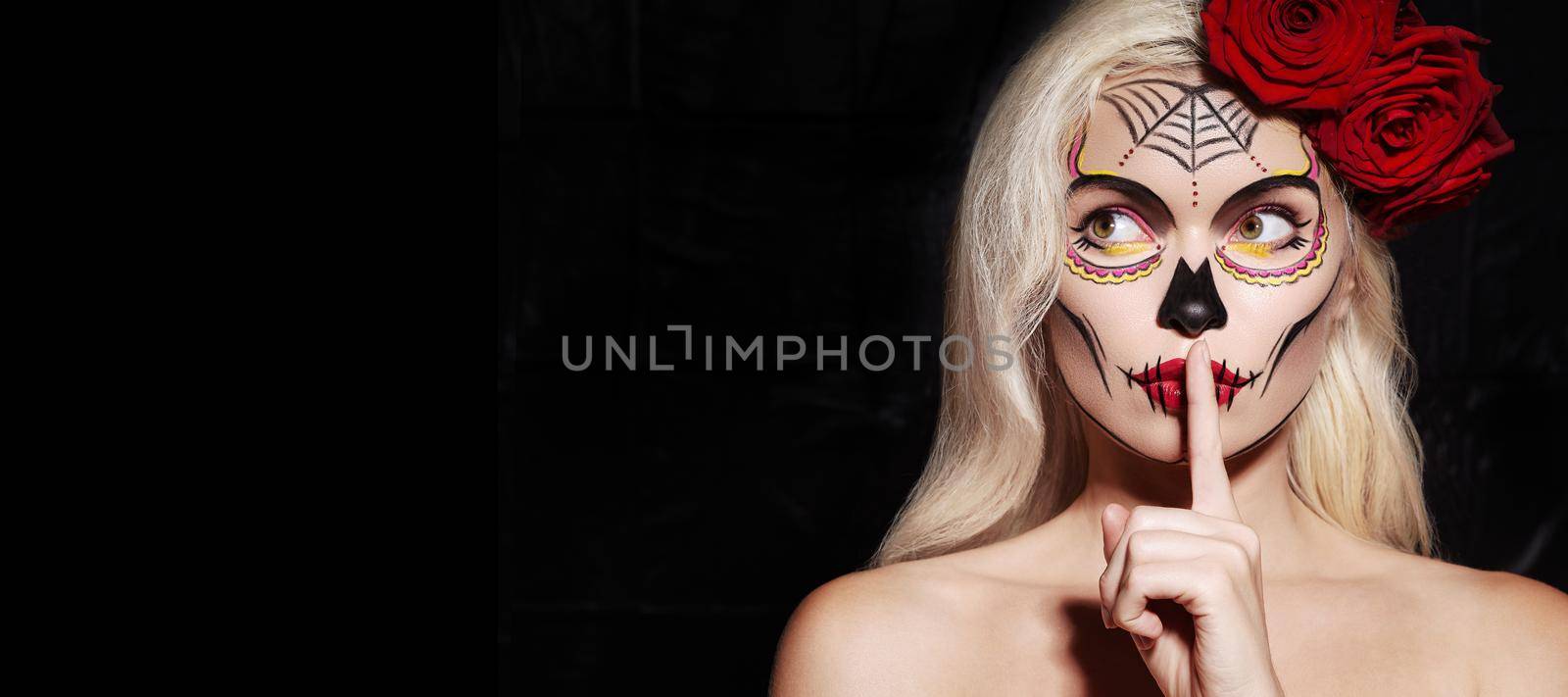 Beautiful Halloween Make-Up Style. Blond Model Wear Sugar Skull Makeup with Red Roses. Santa Muerte concept by MarinaFrost