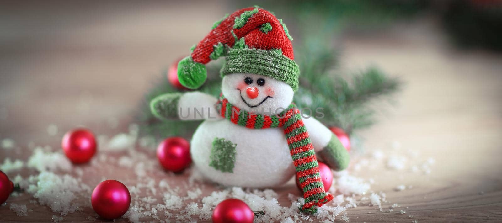Christmas card. toy snowman on a festive background. by SmartPhotoLab