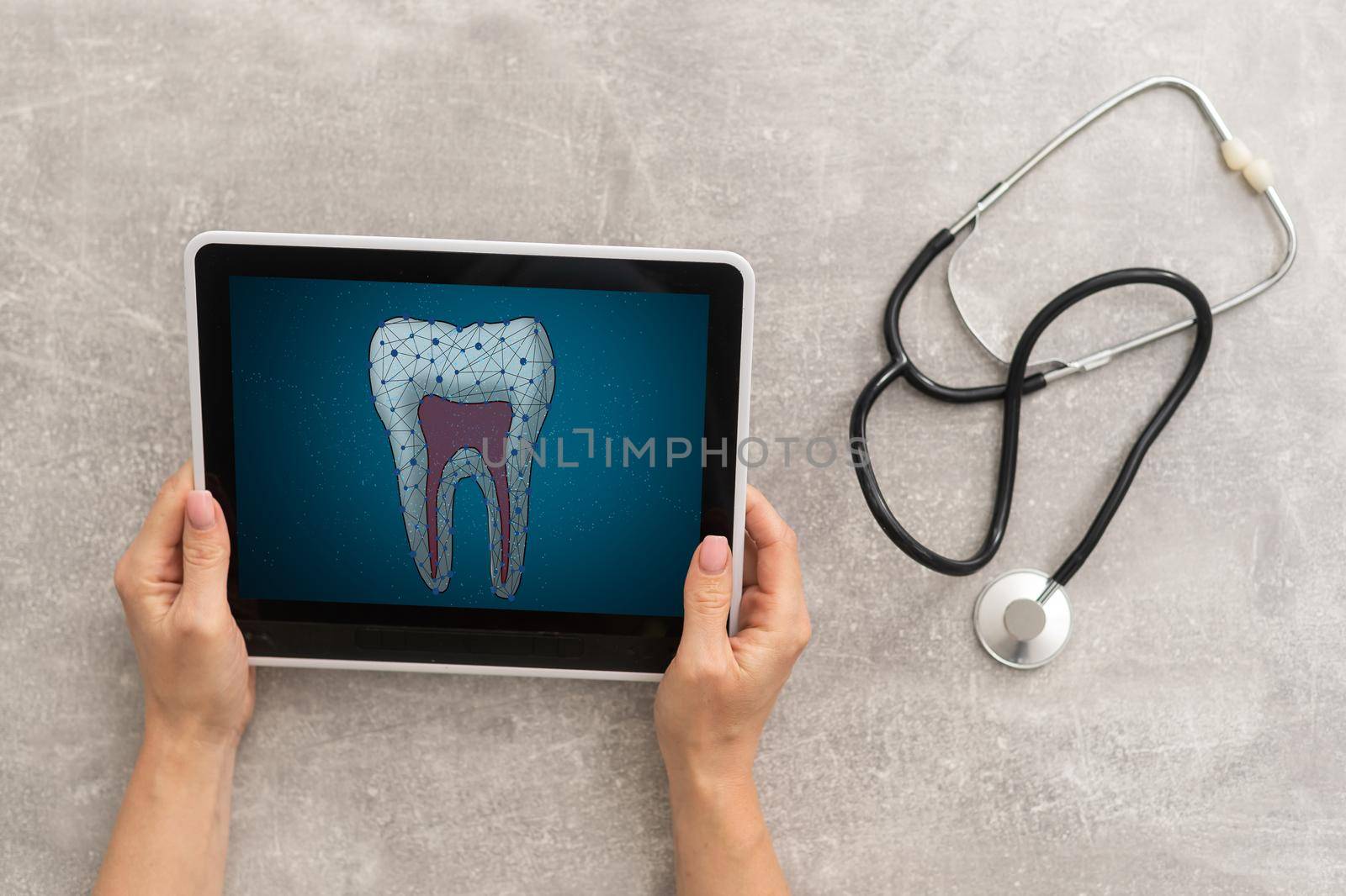 Dentist Office-Digital tablet with a patients x-rays.