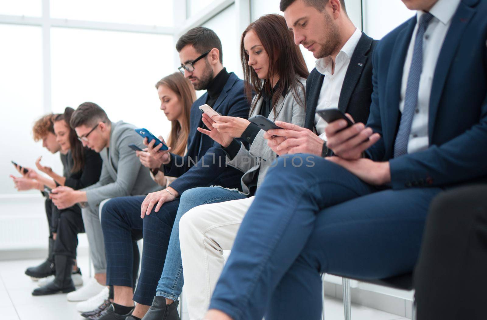 close up. group of casual young people using their gadgets .