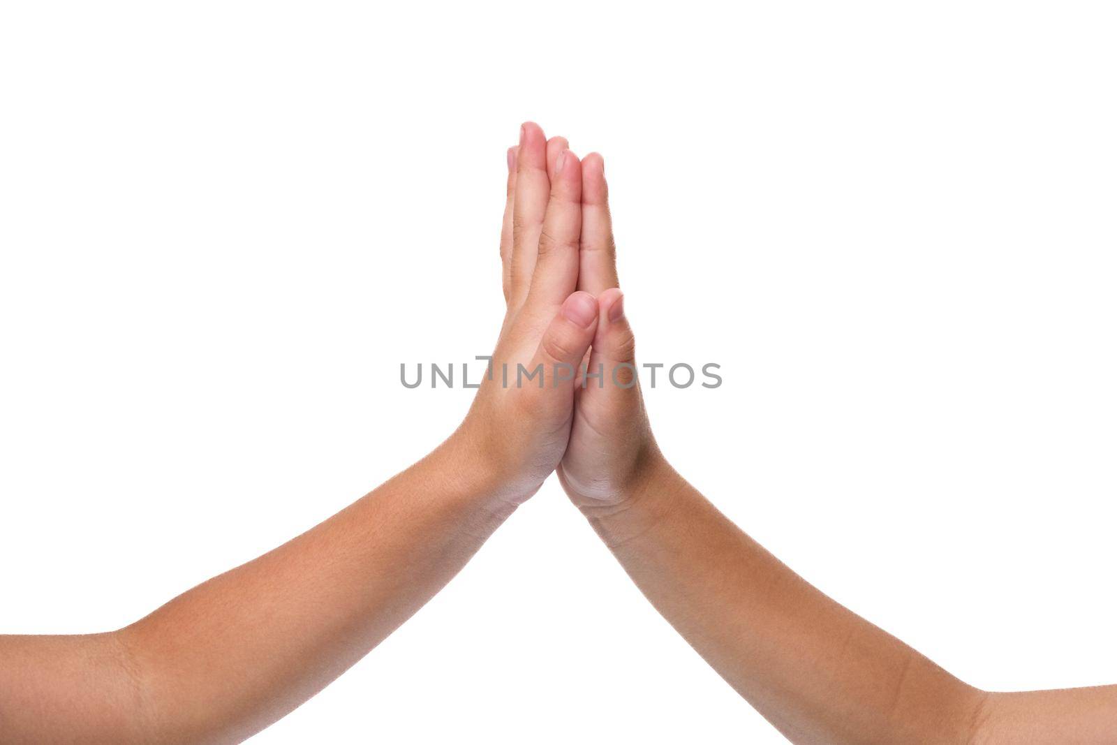 Kids real friendship pictures on white background. Close-up hands of child making hi-five gesture. Win and teamwork concept. by TEERASAK