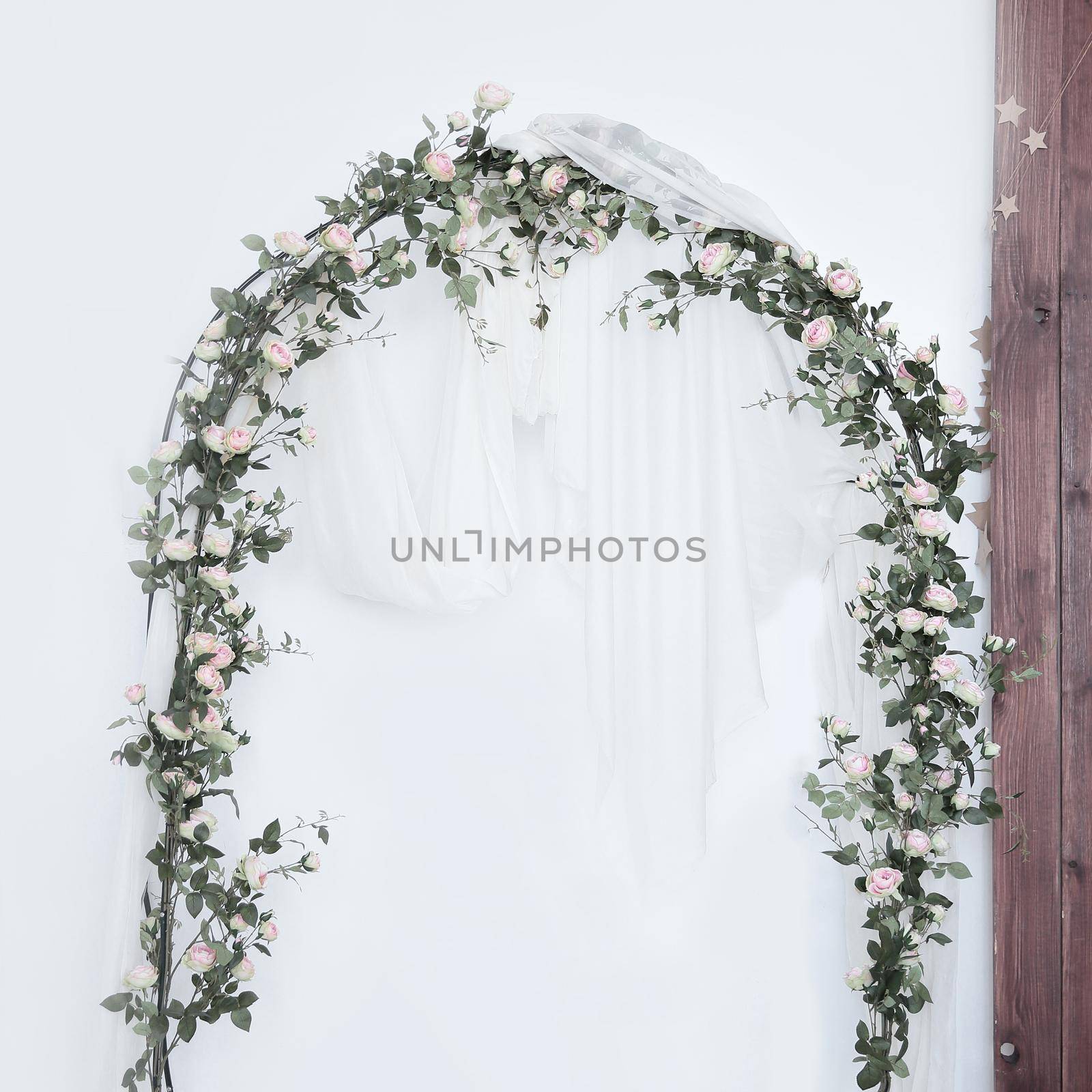 Arch for the wedding ceremony, decorated with cloth and flowers by SmartPhotoLab