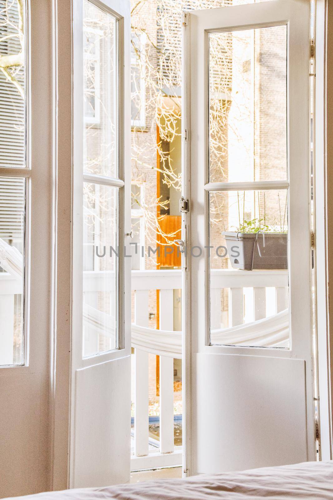 An opened glass doors of a balcony