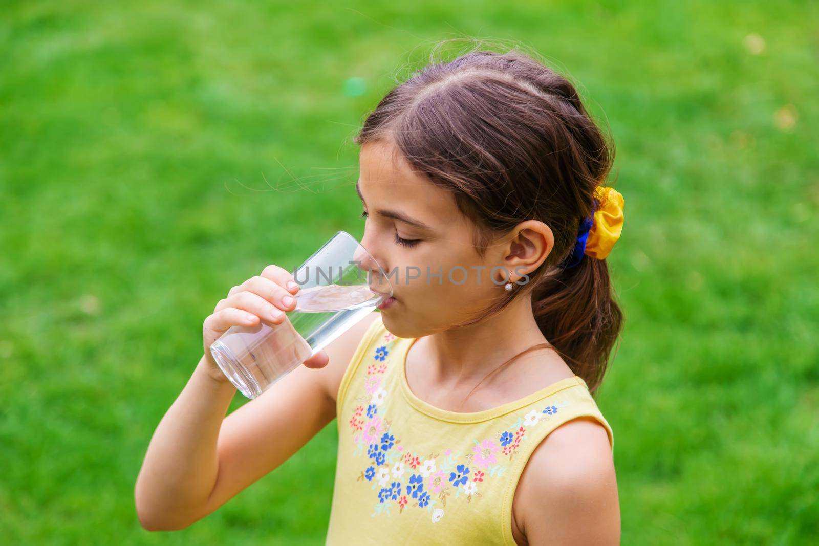 children drink clean water in nature.selective focus.nature