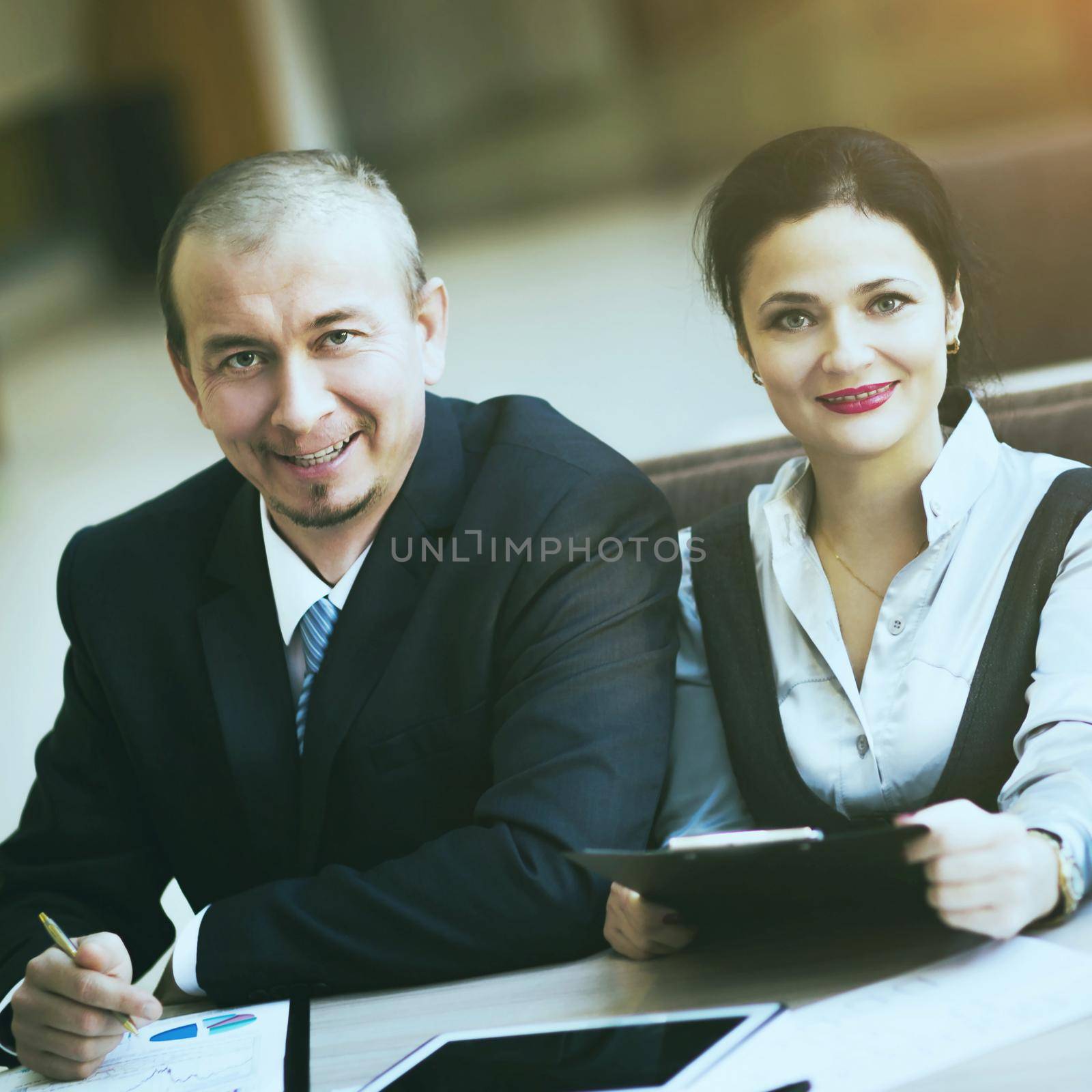 Business team working together to achieve better results, in the office by SmartPhotoLab