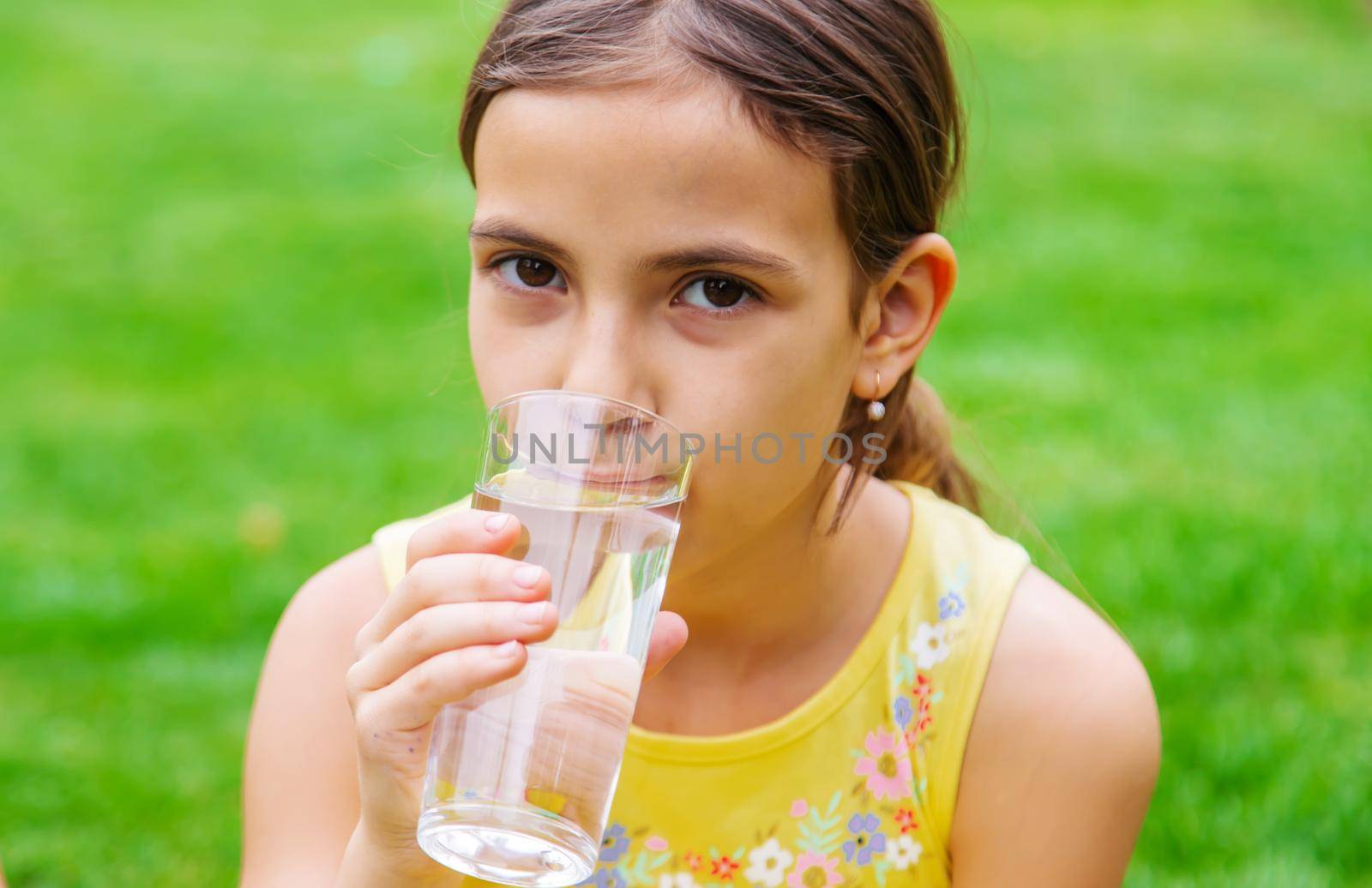 children drink clean water in nature.selective focus.nature