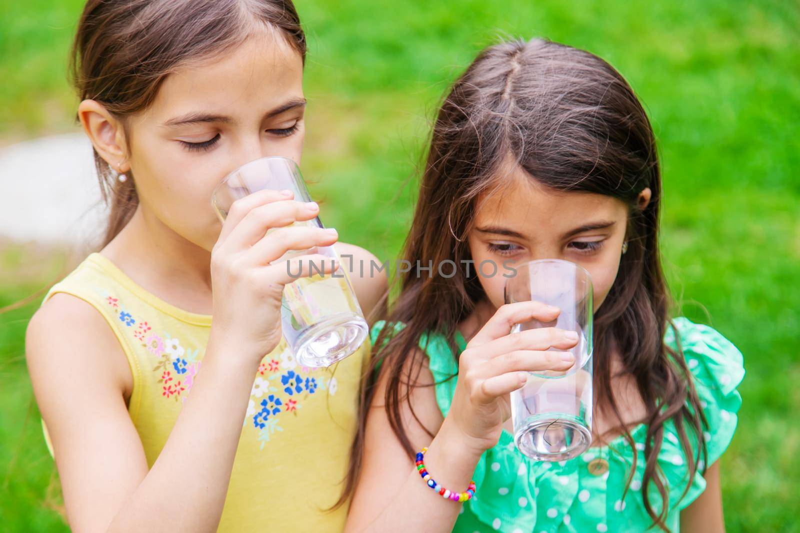 children drink clean water in nature.selective focus.nature