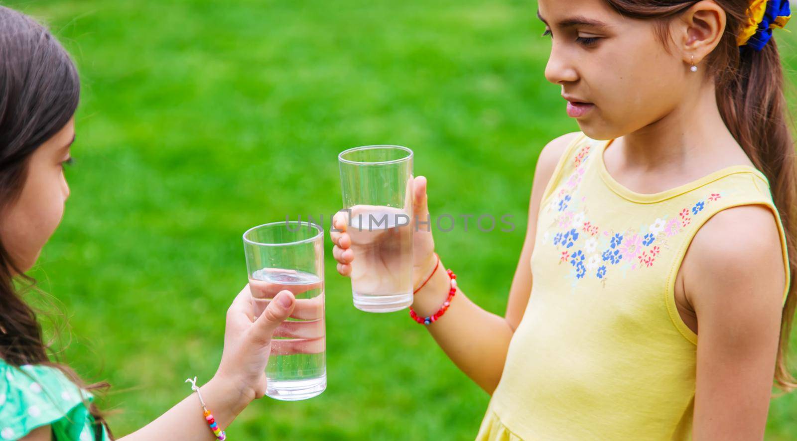 children drink clean water in nature.selective focus.nature