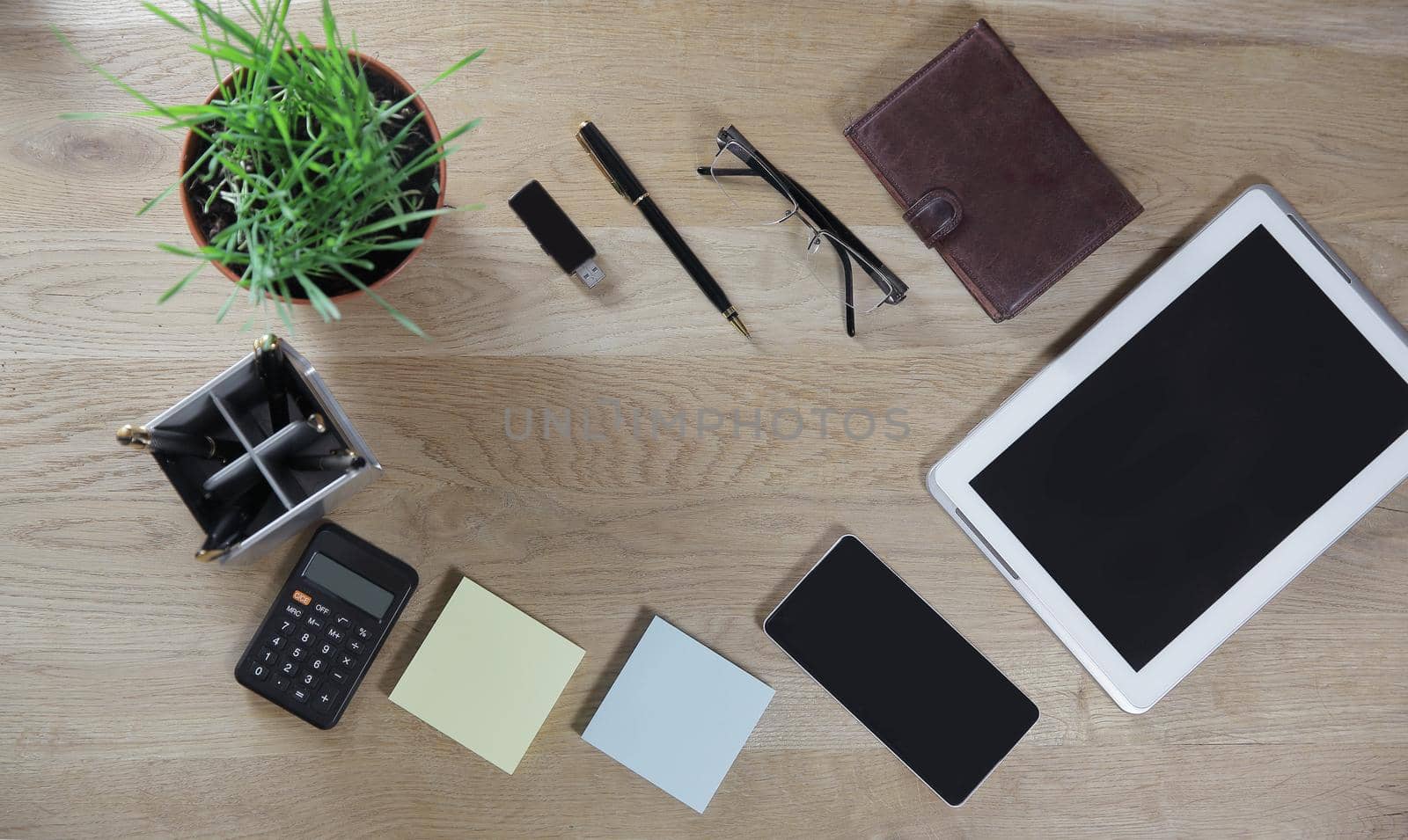 top view.business background.digital tablet and business items on wooden background.