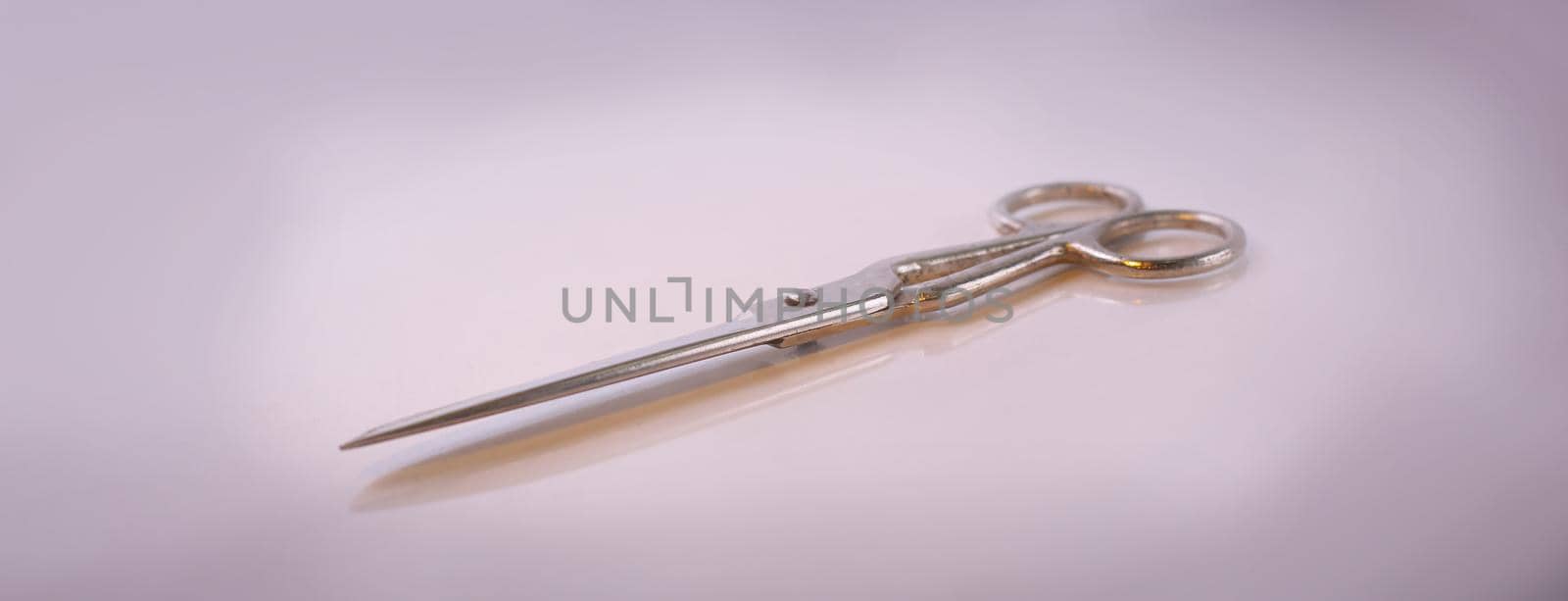 scissors made of metal.isolated on a light background.photo with copy space