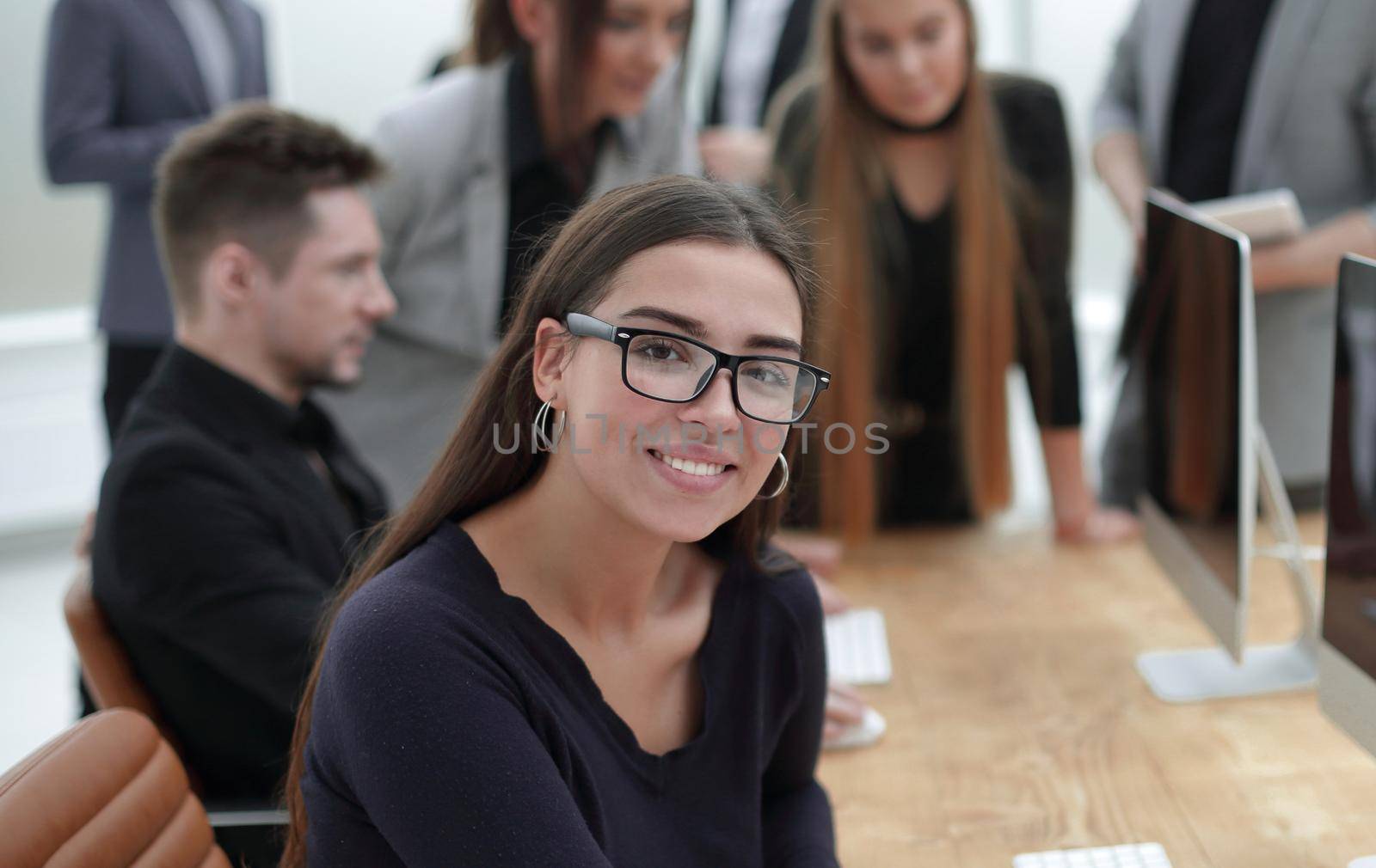 portrait of a young business woman at the workplace by asdf