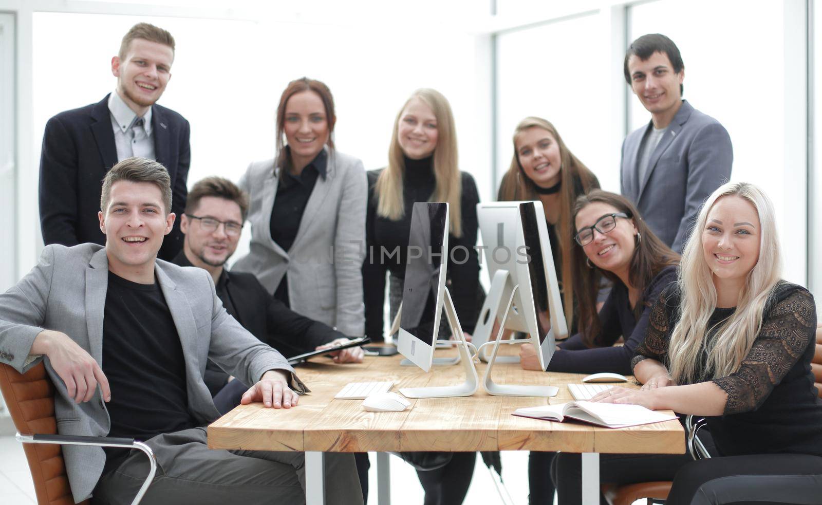 portrait of a group of professional employees in the workplace by asdf