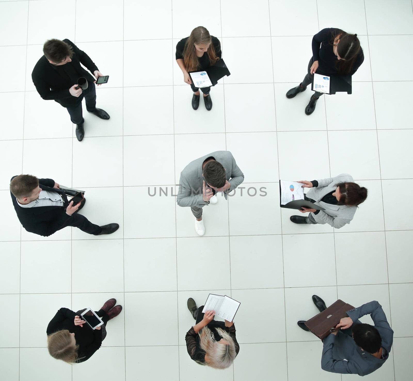 top view. group of diverse business people with financial documents . business concept