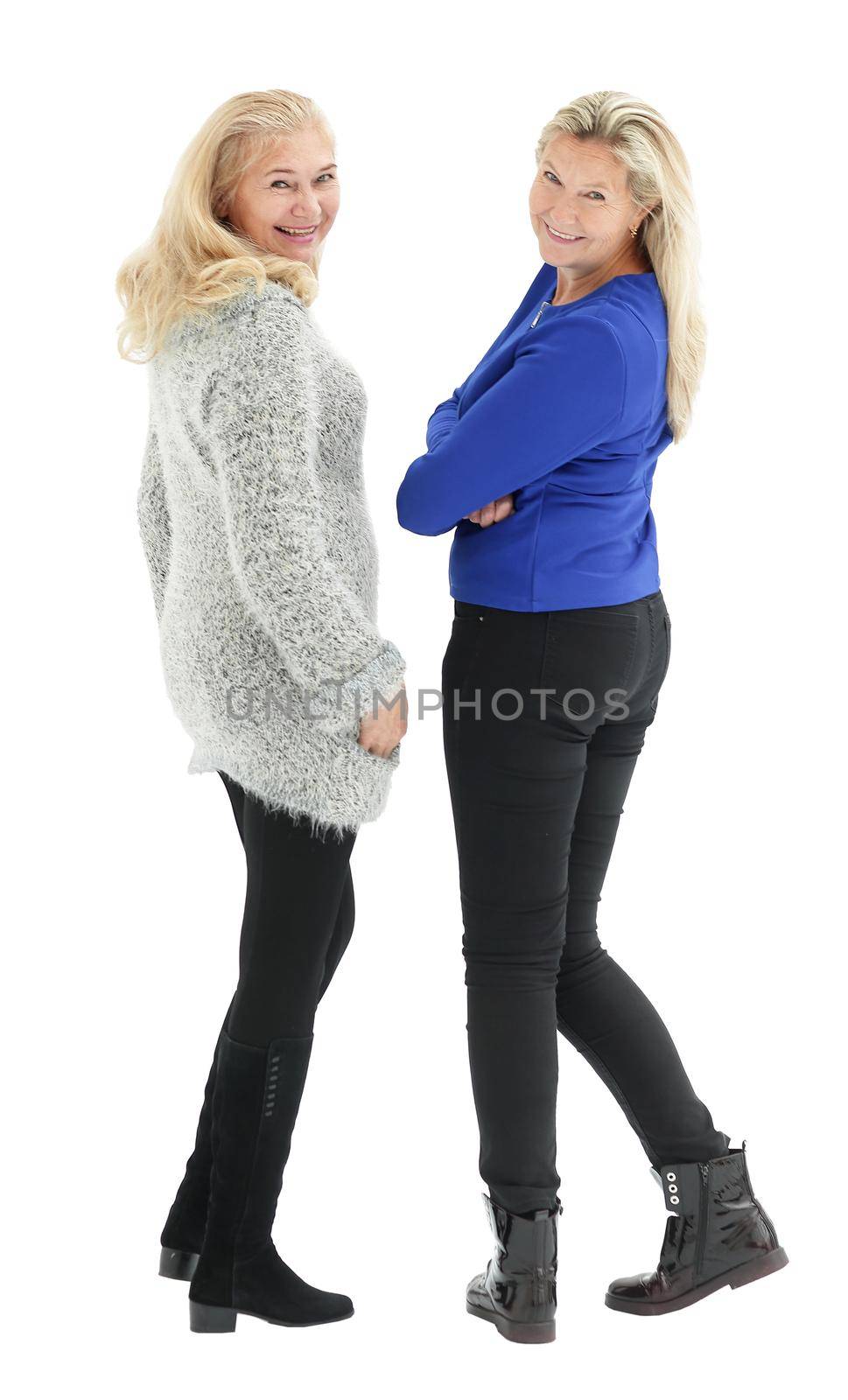 Two happy smiling casual women standing back