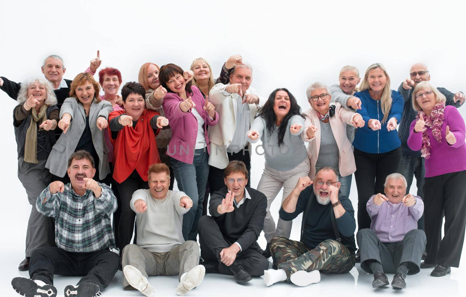 Group of happy elderly people standing and sitting isolated over a white