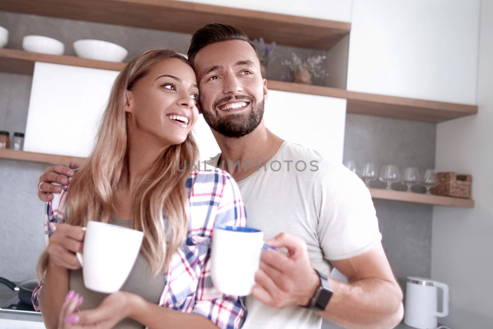 close up. young couple in love in the kitchen in a good morning