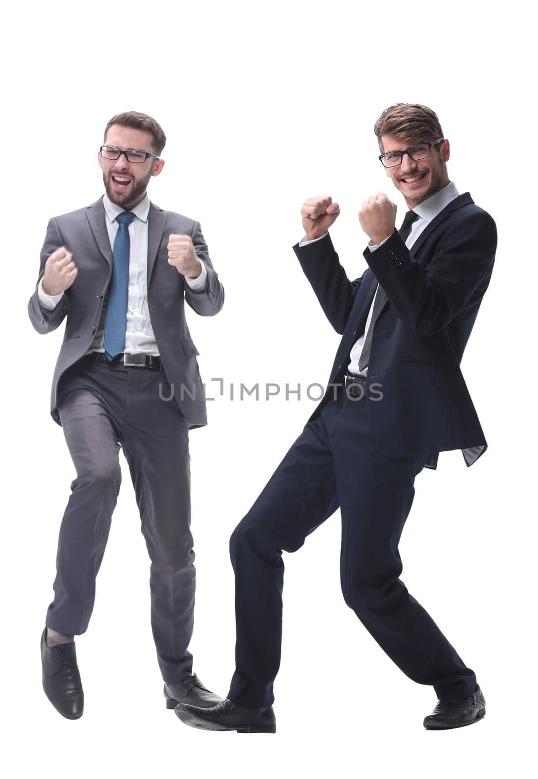 in full growth. two very happy young businessmen . isolated on white background.