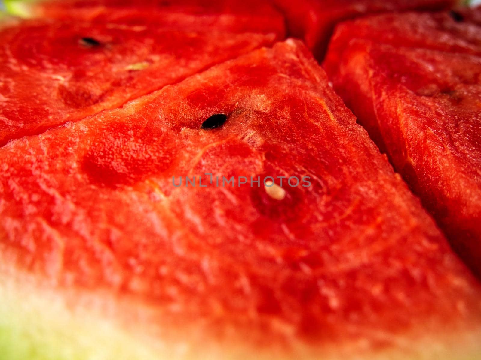 Slice of ripe and juicy watermelon, close-up. triangular slices of fresh watermelon with seeds.