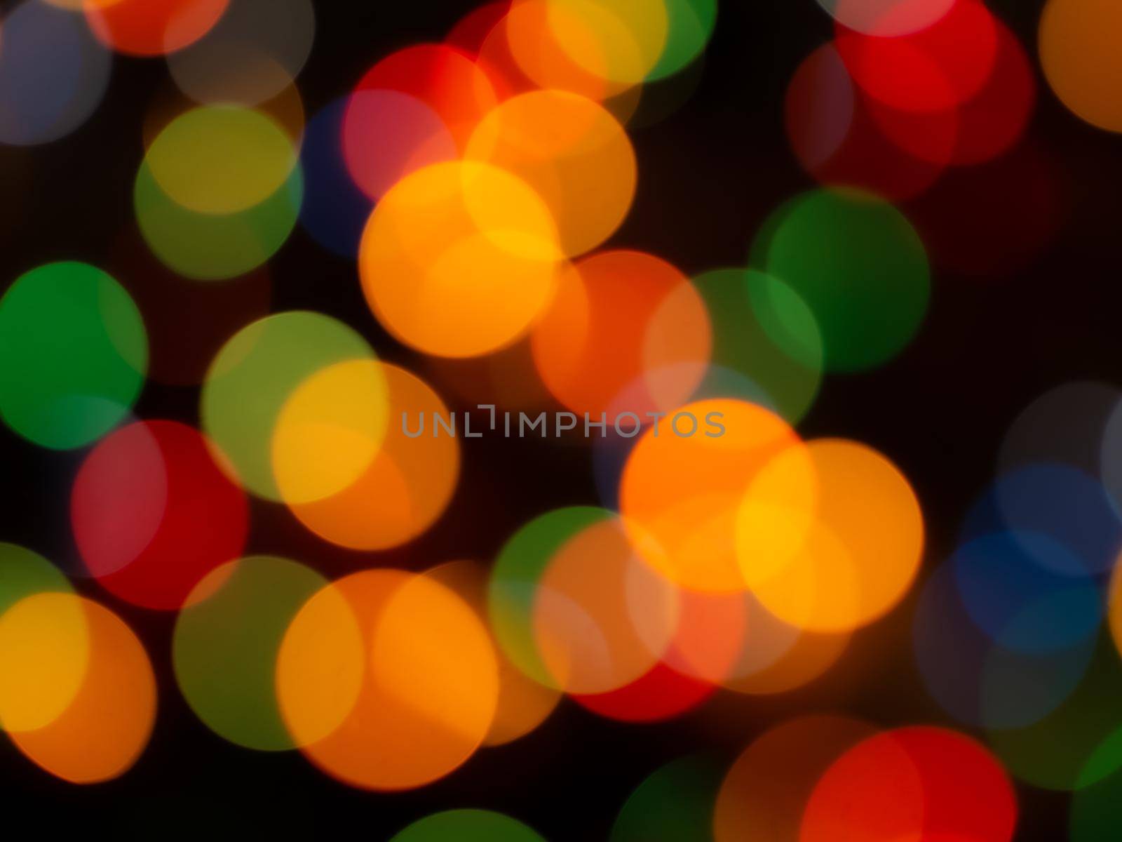 Christmas light background. Holiday glowing backdrop. Defocused Background. Blurred Bokeh.