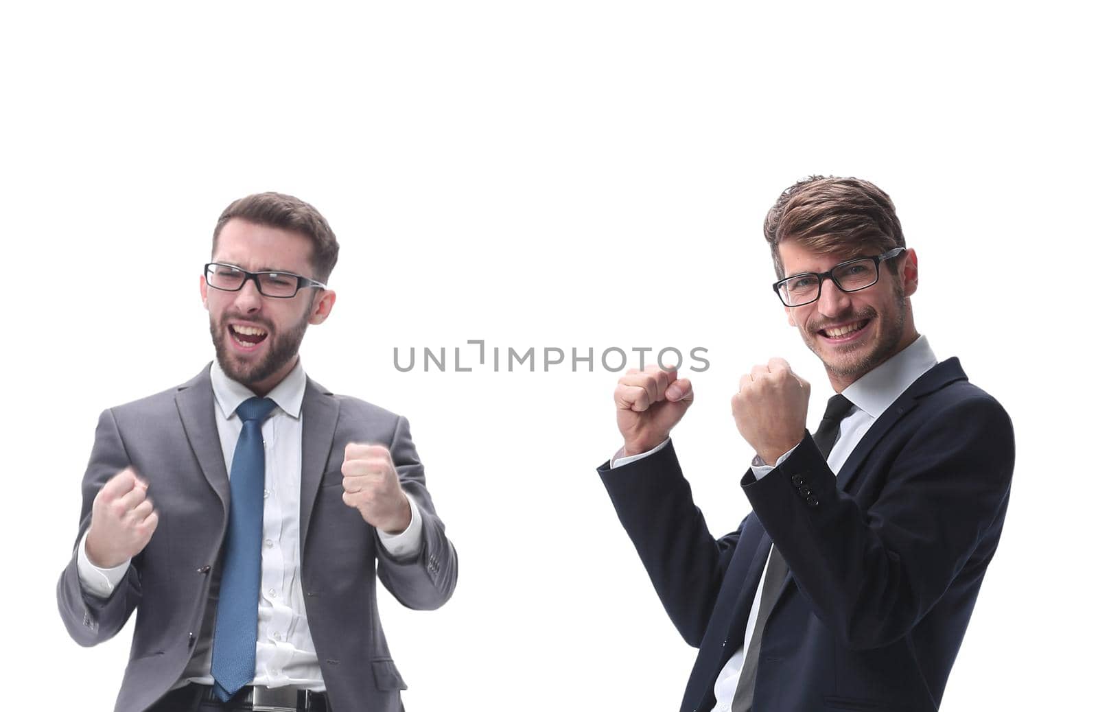 in full growth. two very happy young businessmen . isolated on white background.