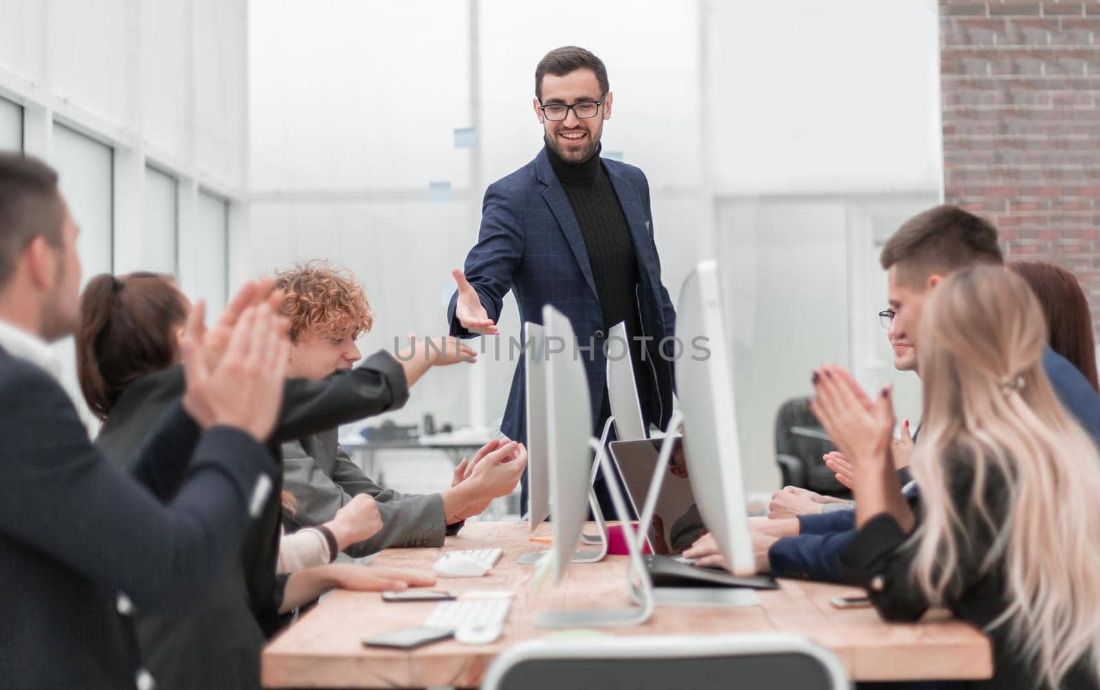 business people shaking hands at a work meeting by asdf