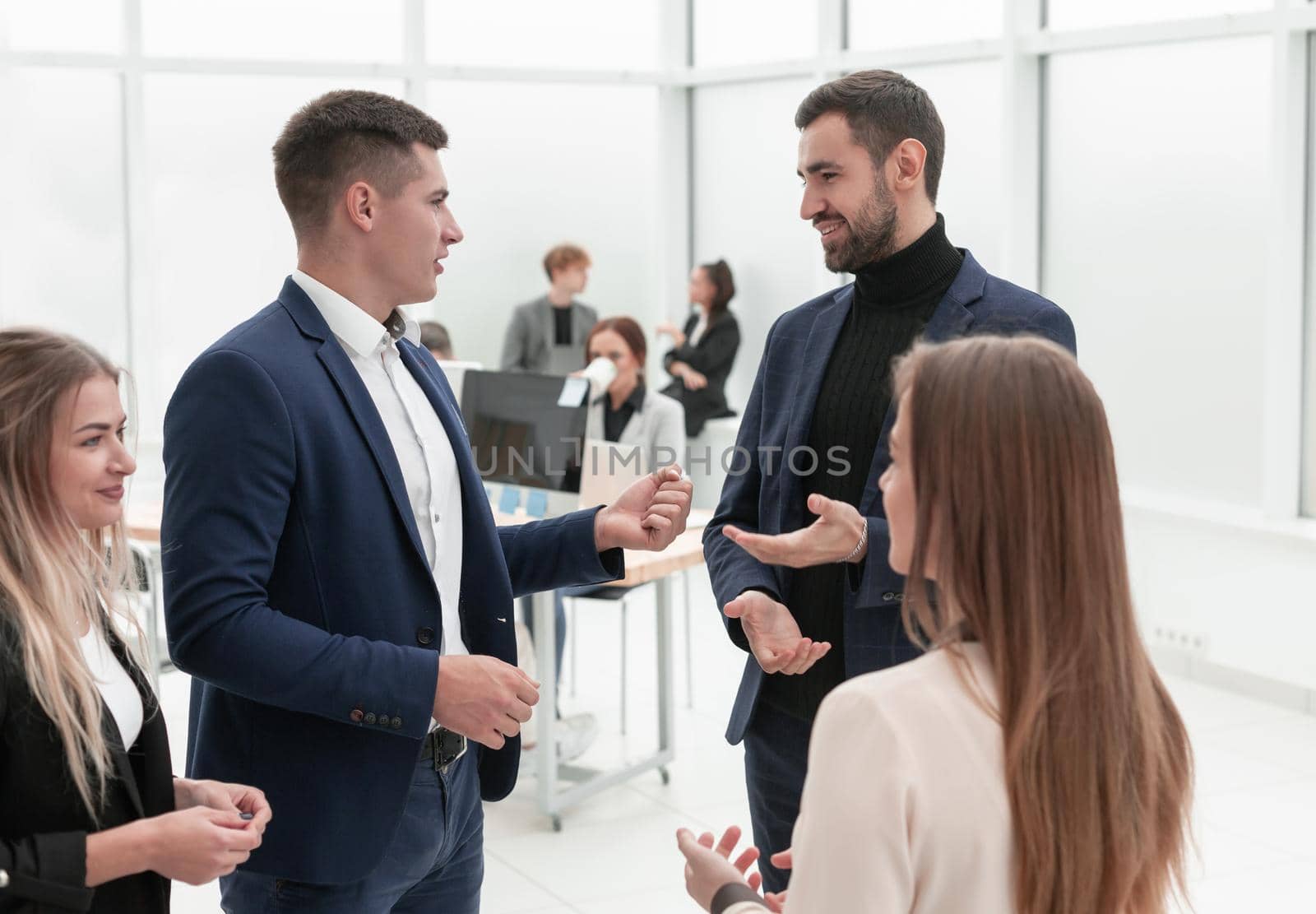business people discuss something standing in the office by asdf