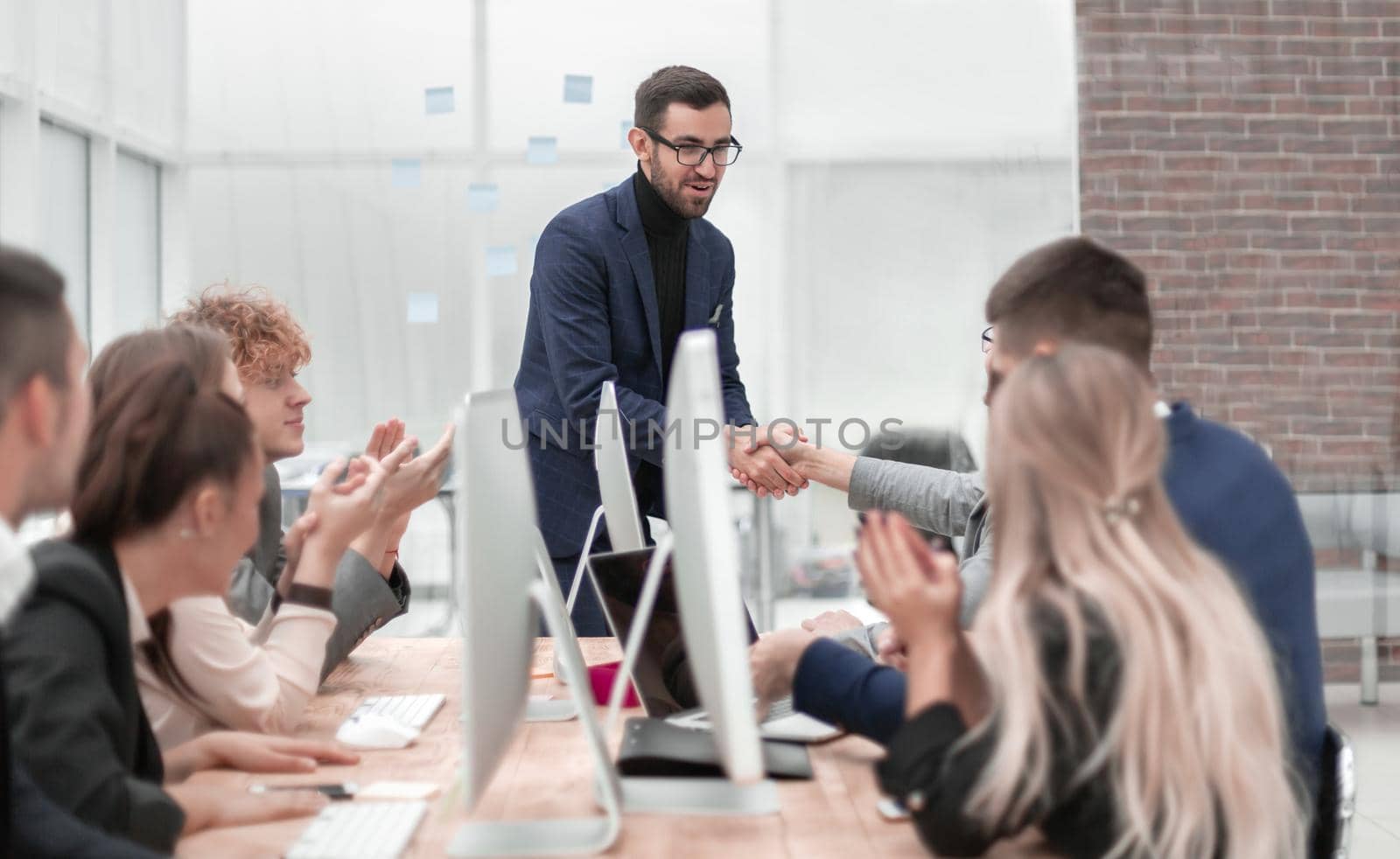 business people shaking hands at a work meeting. photo with copy space