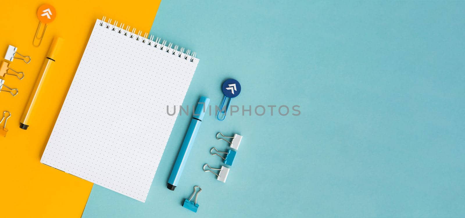 School supplies. Yellow and blue colors. Empty notebook. Flat lay composition. Space for text. Back to school.