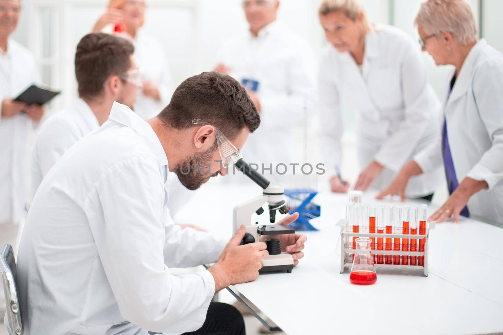 group of scientists working on a new vaccine. by asdf