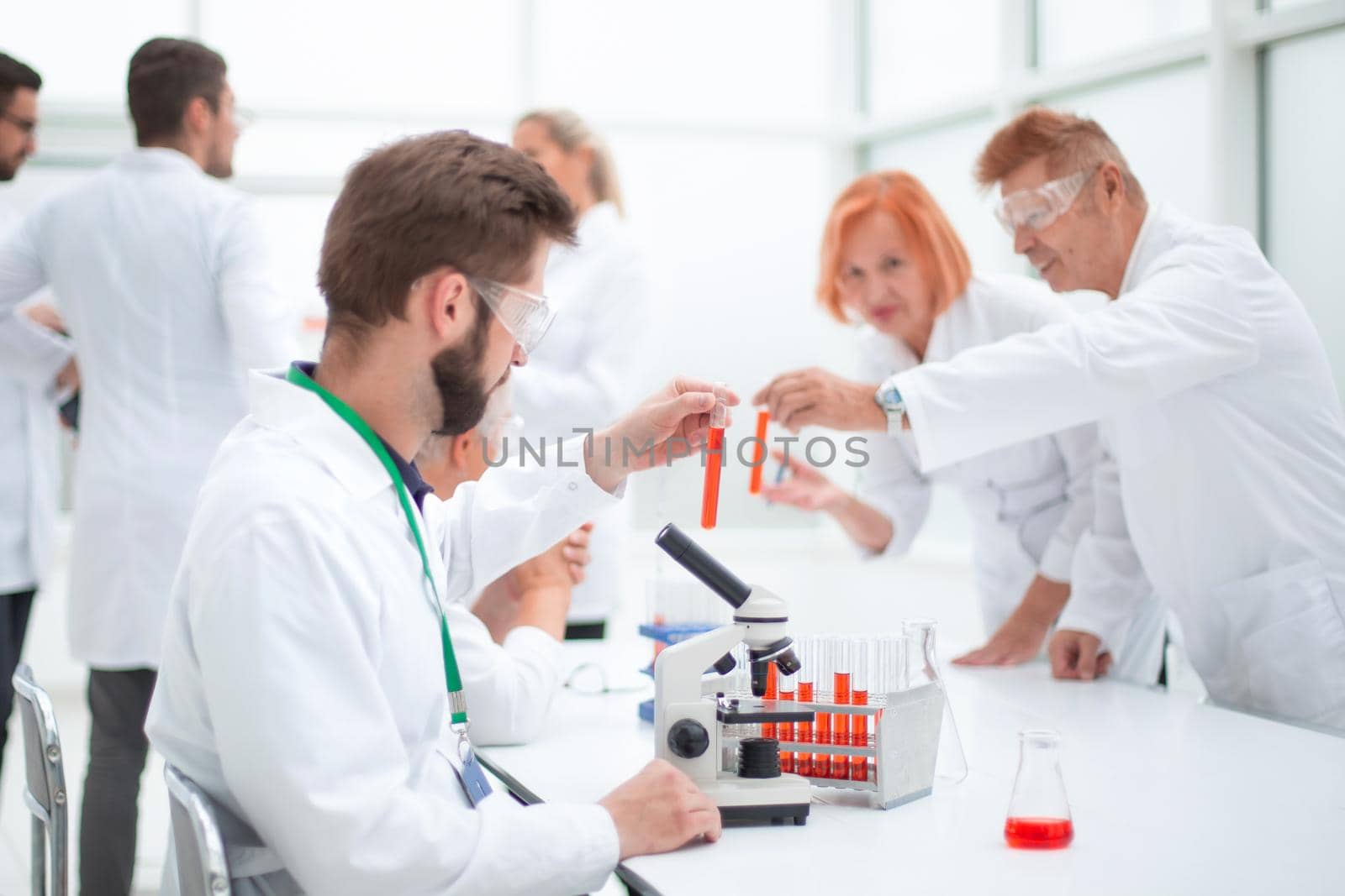 close up. young scientist sitting at a table in the laboratory. concept of health protection.