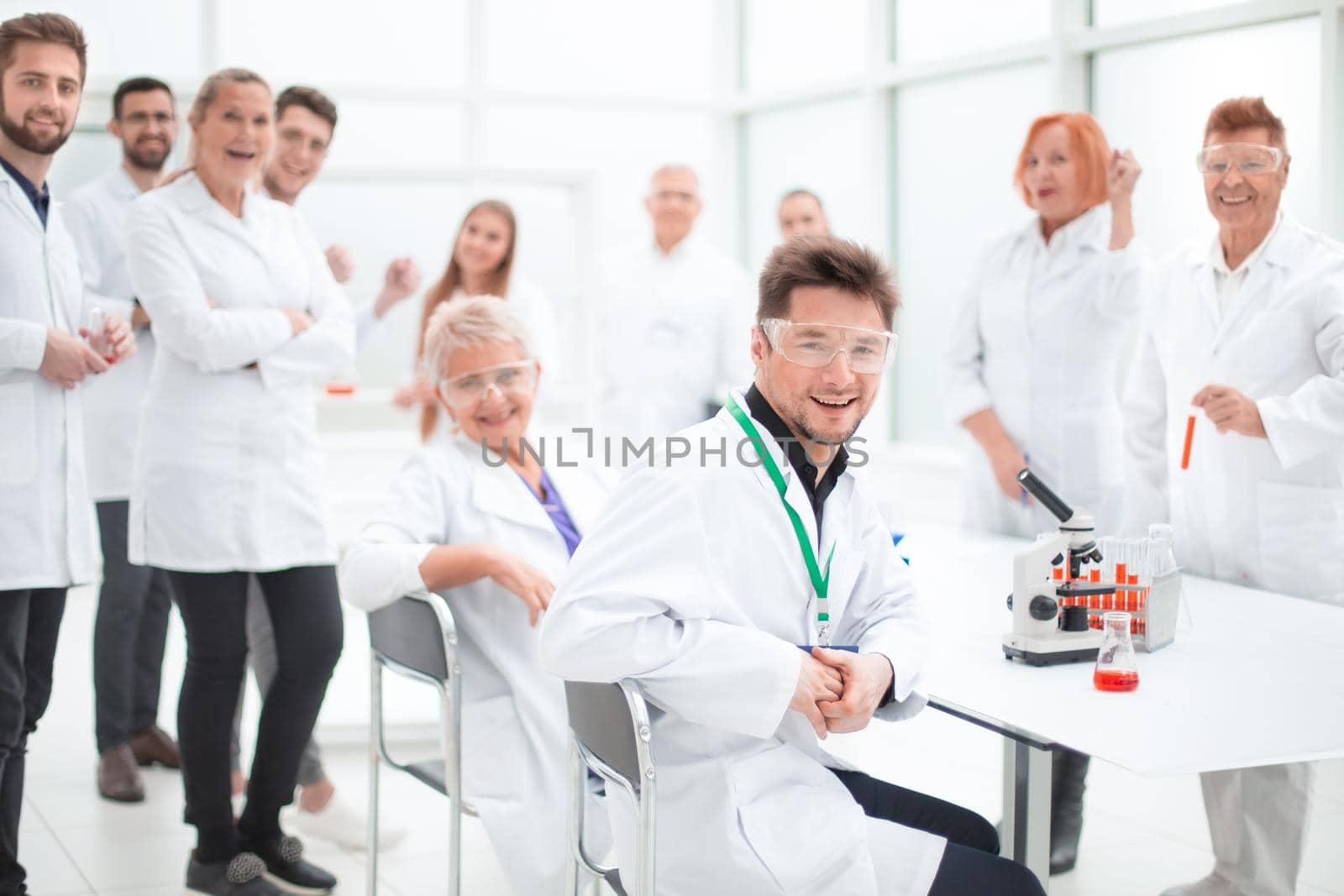 group of researchers at the workplace in the laboratory. by asdf