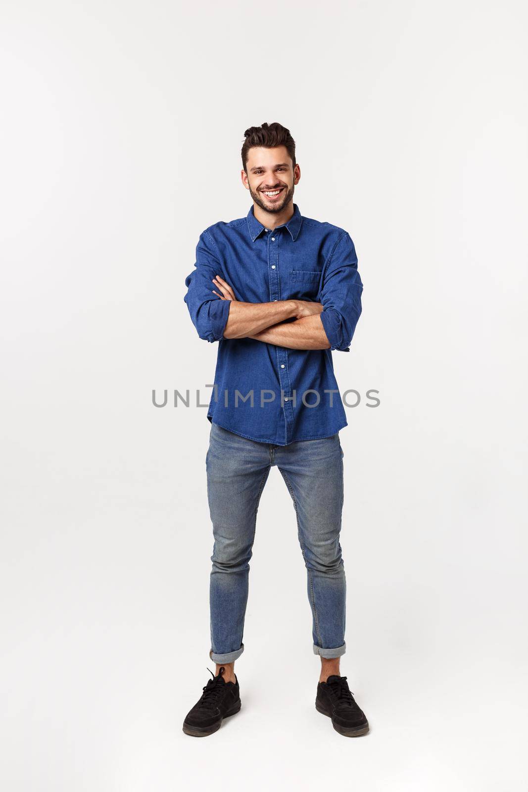 Charming handsome. Handsome young man in casual wear while standing isolated on white background.