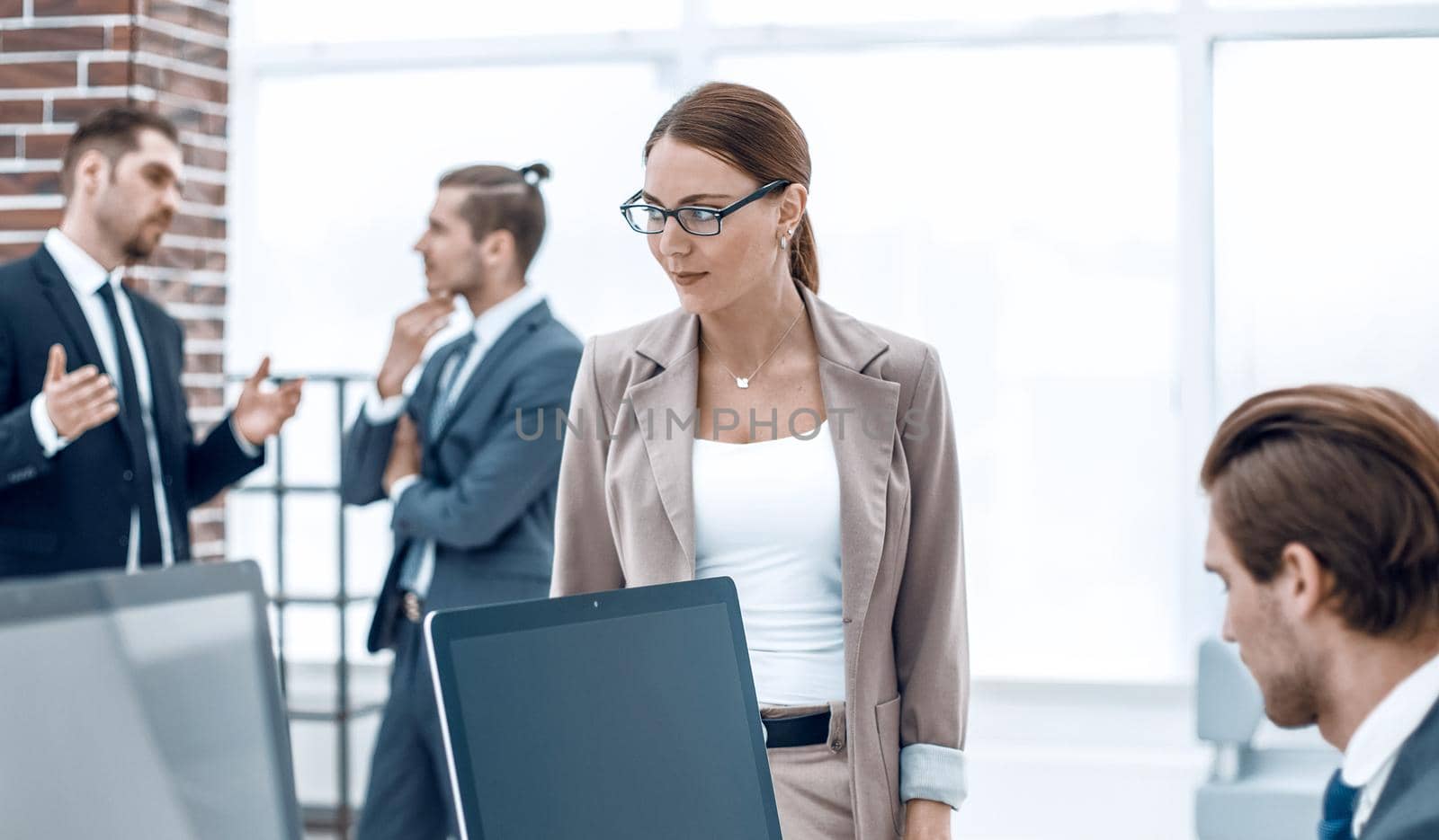 woman Manager standing near the Desk.office weekdays