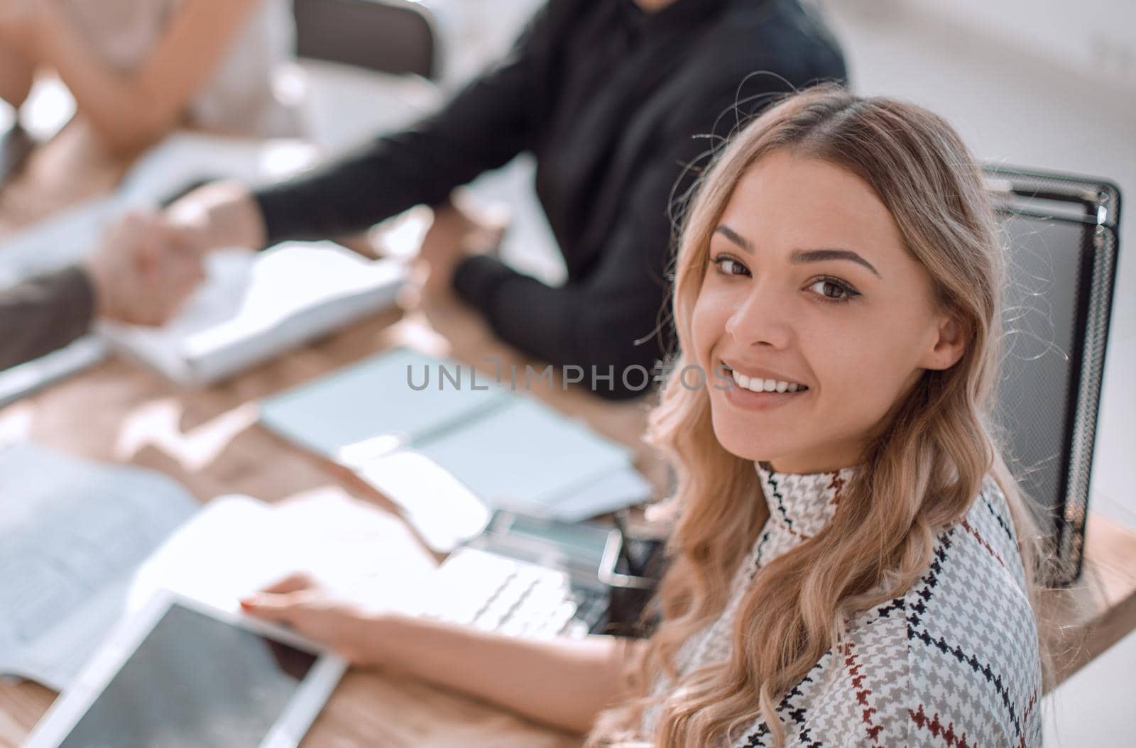 young business woman with a digital tablet at a business meeting by asdf