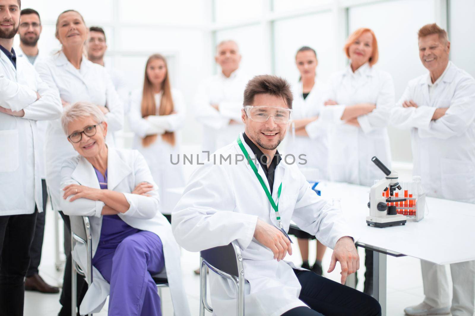 group of doctors and scientists standing in the laboratory. by asdf