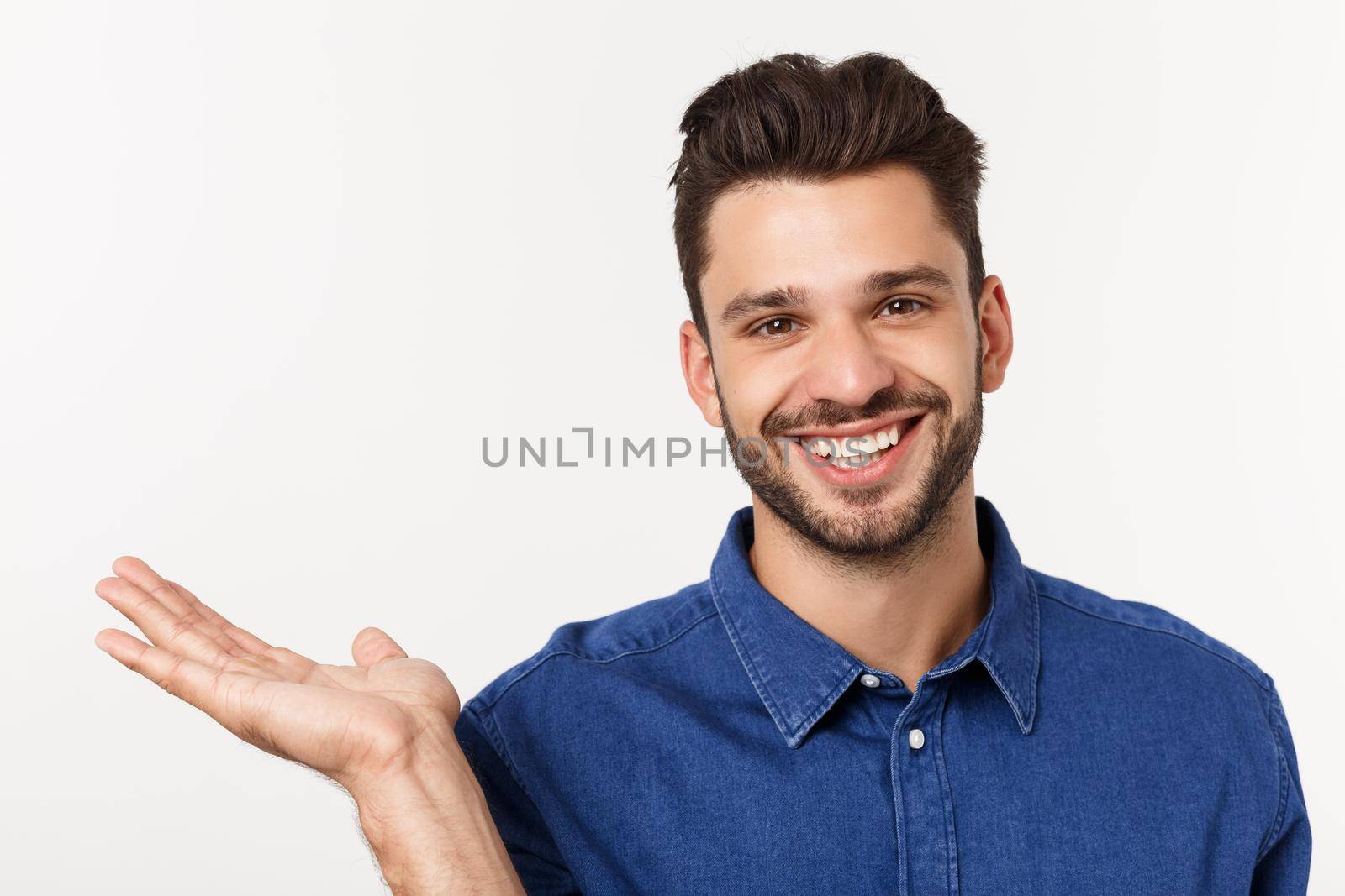 Charming handsome. Handsome young man in casual wear while standing isolated on white background.